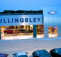 A closer shot of the Billingsly dealership parking lot by day